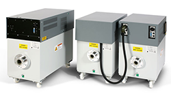 Three white and grey x-ray generators lined up next to each other