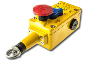 An amaergency stop button with yellow casing and a red button as part of an NDT safety system